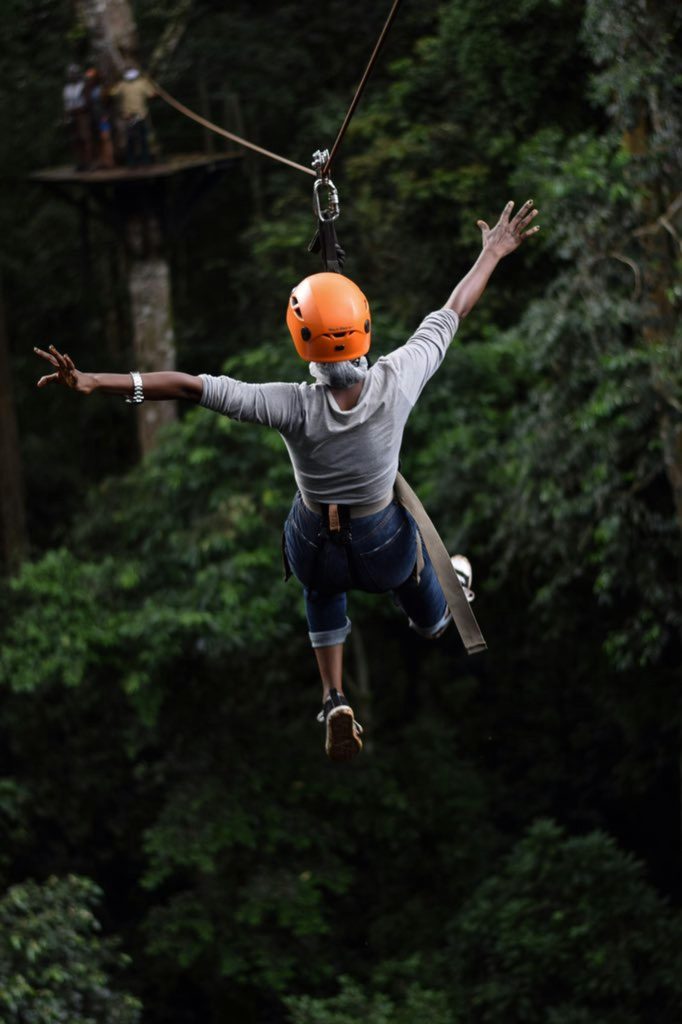 pexels-photo-28263612-28263612 Experience the thrill of ziplining through Uganda's lush forests with this adventurous capture.